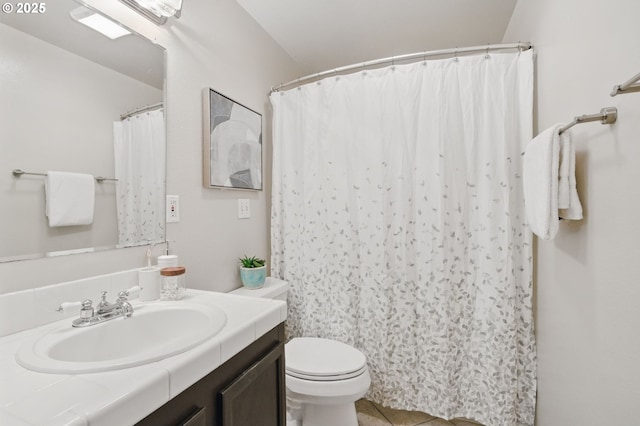 bathroom featuring vanity, toilet, and a shower with curtain