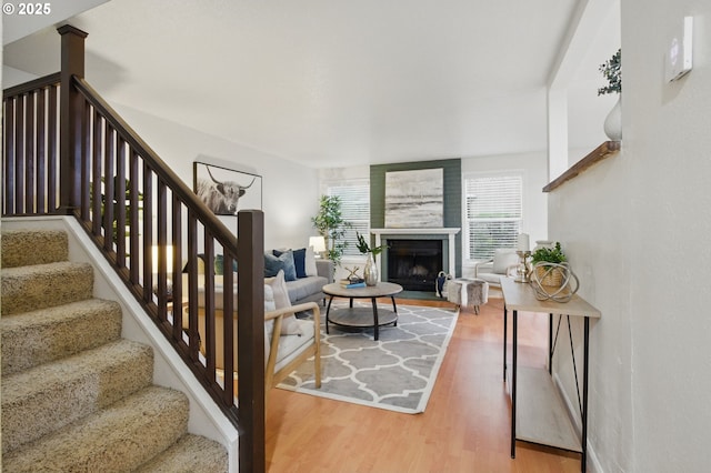 29460 SW Volley St Unit 67, Wilsonville, OR 97070 - living area with wood finished floors, stairs, and a fireplace
