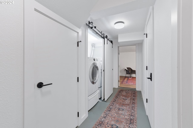 7516 N Brandon Ave, Portland, OR 97217 - laundry area featuring a barn door and washer / clothes dryer