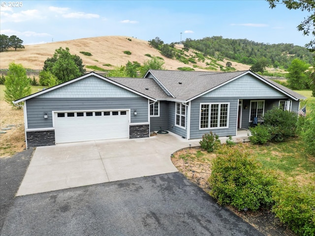 445 Hatfield Dr, Roseburg, OR 97470 - ranch-style house featuring driveway, a garage, stone siding, and a shingled roof
