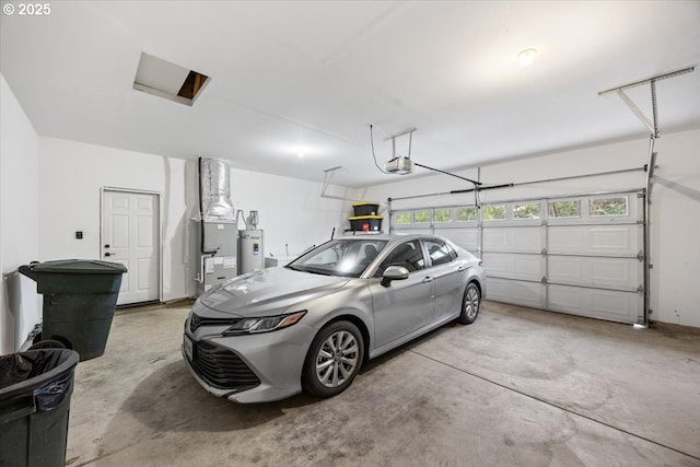 445 Hatfield Dr, Roseburg, OR 97470 - garage featuring electric water heater, a garage door opener, and heating unit