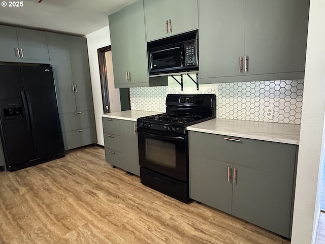 404 NE High St, Goldendale, WA 98620 - kitchen with black appliances, gray cabinets, and light countertops