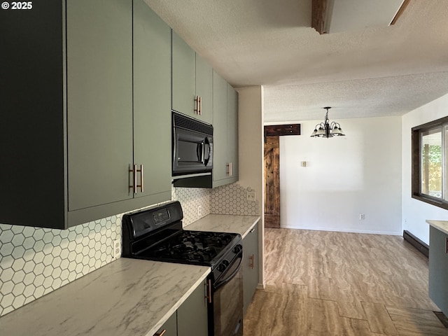 404 NE High St, Goldendale, WA 98620 - kitchen with black appliances, green cabinets, a chandelier, decorative backsplash, and a textured ceiling