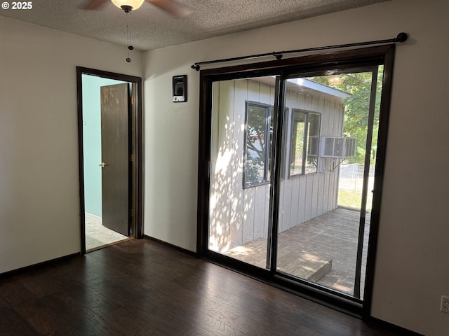 404 NE High St, Goldendale, WA 98620 - doorway featuring a textured ceiling, wood finished floors, a ceiling fan, and baseboards