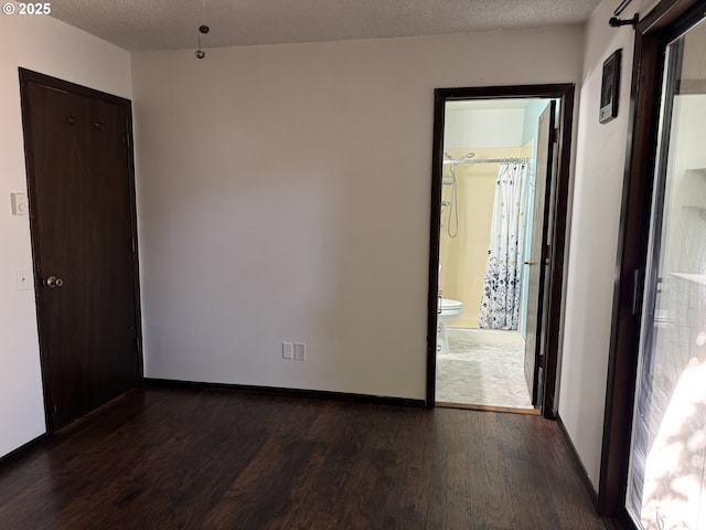 404 NE High St, Goldendale, WA 98620 - spare room with wood finished floors, baseboards, and a textured ceiling