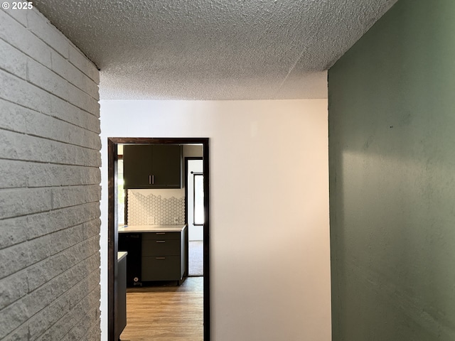 404 NE High St, Goldendale, WA 98620 - hall with light wood-style flooring and a textured ceiling