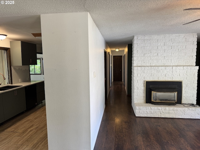 404 NE High St, Goldendale, WA 98620 - corridor with a sink, wood finished floors, and a textured ceiling