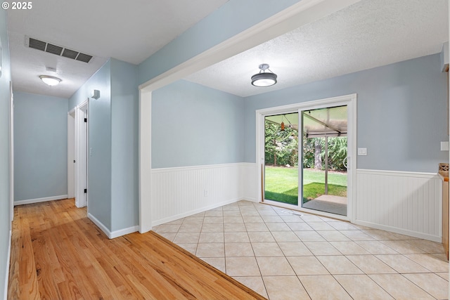 16880 Tracy Ave, Lake Oswego, OR 97035 - spare room featuring a wainscoted wall and light wood finished floors