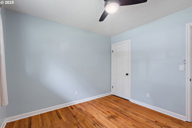 16880 Tracy Ave, Lake Oswego, OR 97035 - unfurnished room with ceiling fan, wood finished floors, and a textured ceiling