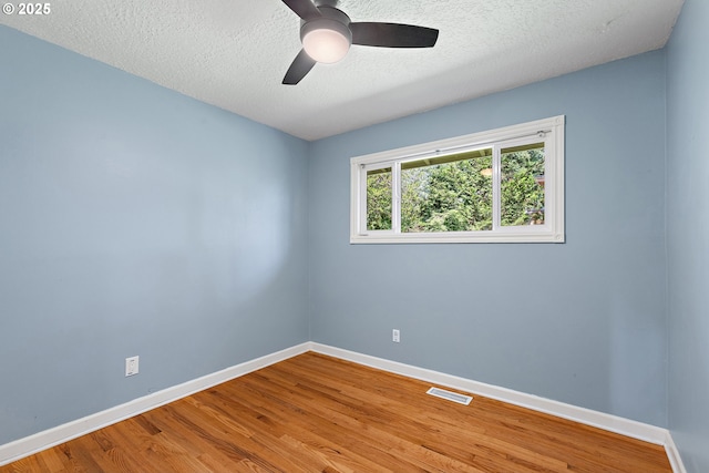 16880 Tracy Ave, Lake Oswego, OR 97035 - empty room with a ceiling fan, wood finished floors, and a textured ceiling