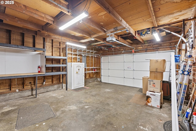 16880 Tracy Ave, Lake Oswego, OR 97035 - garage with a garage door opener and a workshop area