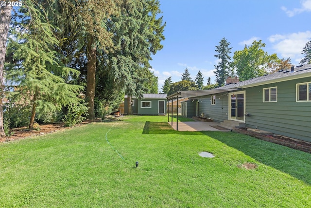 16880 Tracy Ave, Lake Oswego, OR 97035 - view of green lawn featuring an outdoor structure, a patio, and entry steps