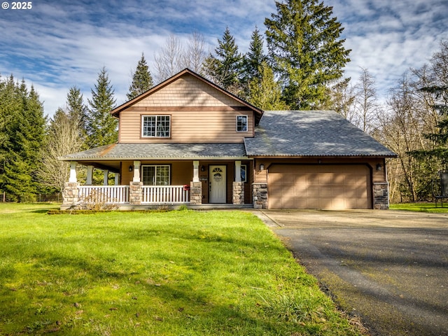 view of front facade with covered porch, aphalt driveway, a front lawn, and an attached garage