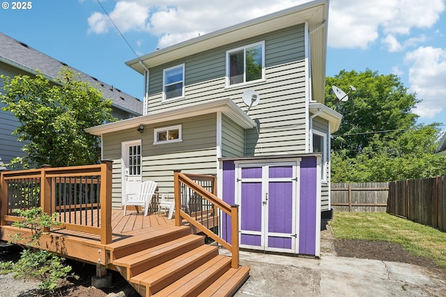 5018 N Vanderbilt St, Portland, OR 97203 - rear view of house with a deck and a storage shed