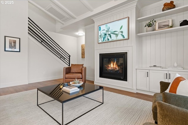 3653 Maidenhair Pl S, Salem, OR 97302 - living area with stairway, baseboards, a large fireplace, and wood finished floors