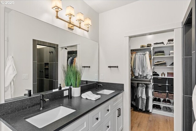 3653 Maidenhair Pl S, Salem, OR 97302 - full bath featuring a walk in closet, wood finished floors, a sink, and double vanity