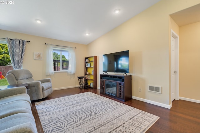 3606 Walnut Ln, Tillamook, OR 97141 - living area featuring healthy amount of natural light, dark wood-style floors, a glass covered fireplace, and recessed lighting