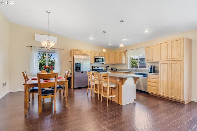 3606 Walnut Ln, Tillamook, OR 97141 - kitchen with appliances with stainless steel finishes, light brown cabinets, lofted ceiling, a chandelier, and a sink