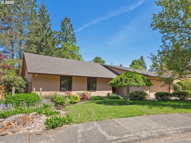 ranch-style house with a shingled roof and a front yard