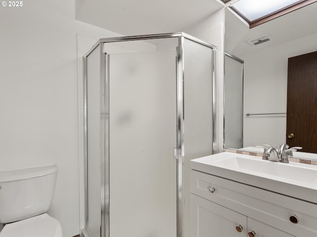 full bathroom with vanity, toilet, visible vents, and a stall shower