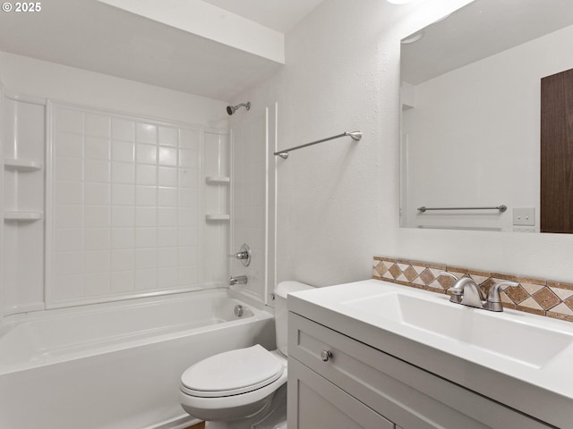 bathroom featuring vanity, tub / shower combination, and toilet