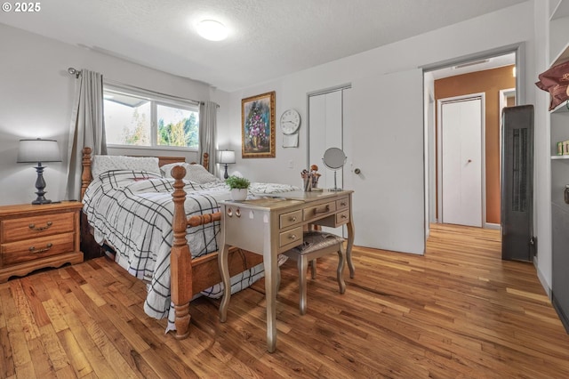 52396 SW 2nd St, Scappoose, OR 97056 - bedroom featuring a heating unit, light wood finished floors, and a closet
