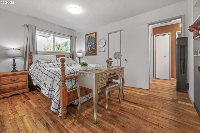 52396 SW 2nd St, Scappoose, OR 97056 - bedroom featuring a heating unit, light wood finished floors, and a closet