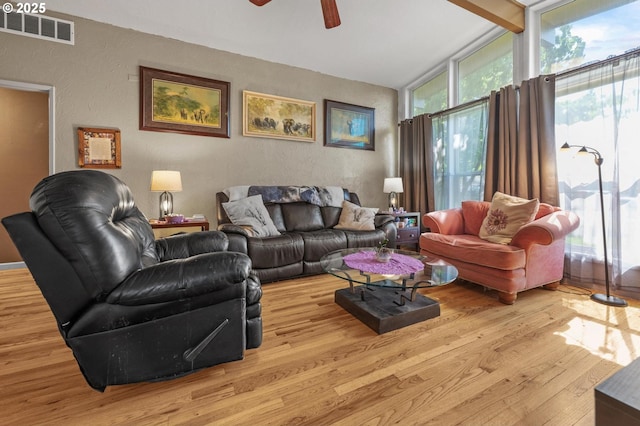52396 SW 2nd St, Scappoose, OR 97056 - living room featuring wood finished floors, a ceiling fan, a textured wall, and lofted ceiling
