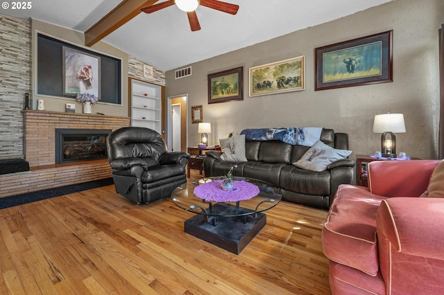 52396 SW 2nd St, Scappoose, OR 97056 - living area with a ceiling fan, wood finished floors, built in features, and a fireplace