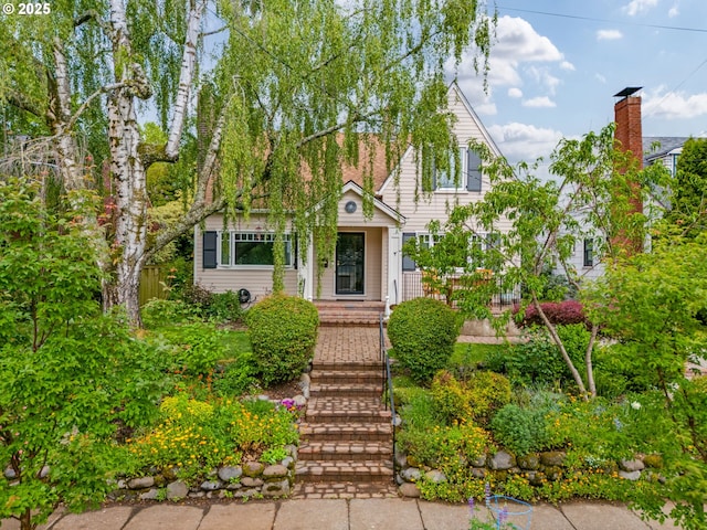 view of front of home featuring fence