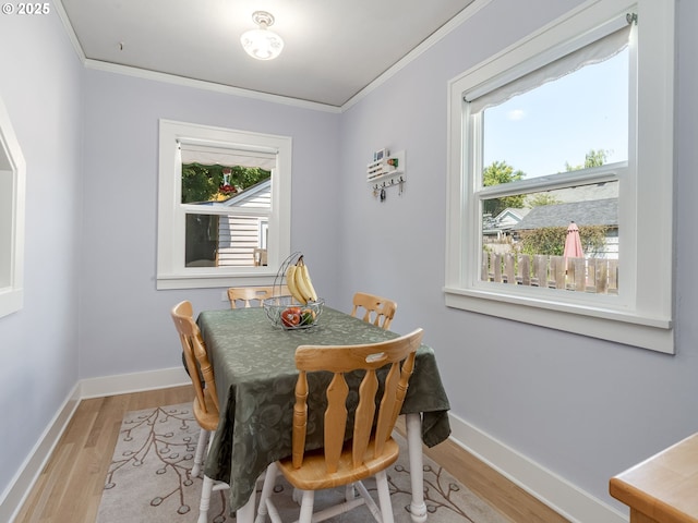 4415 SE Stark St, Portland, OR 97215 - dining area with light wood finished floors and ornamental molding