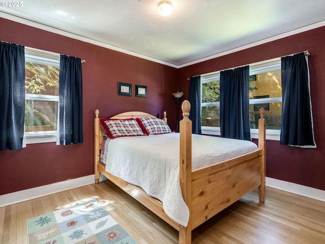 4415 SE Stark St, Portland, OR 97215 - bedroom featuring wood finished floors and ornamental molding