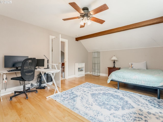 bedroom featuring wood finished floors, an office area, baseboards, and a ceiling fan