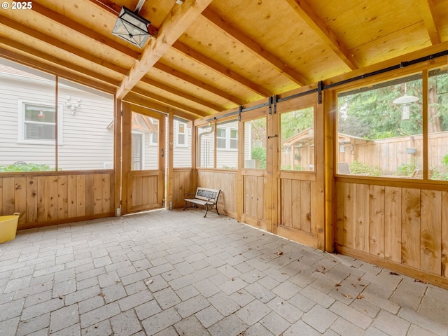 unfurnished sunroom with plenty of natural light