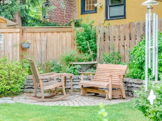 view of yard featuring fence and a patio area
