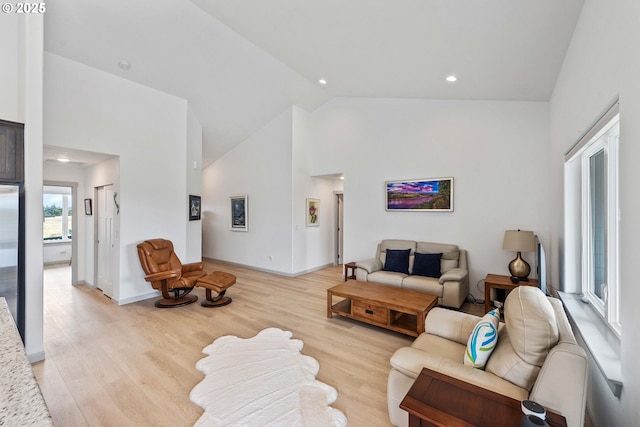822 Spyglass Dr, Bandon, OR 97411 - living room featuring high vaulted ceiling, light wood-style flooring, and recessed lighting