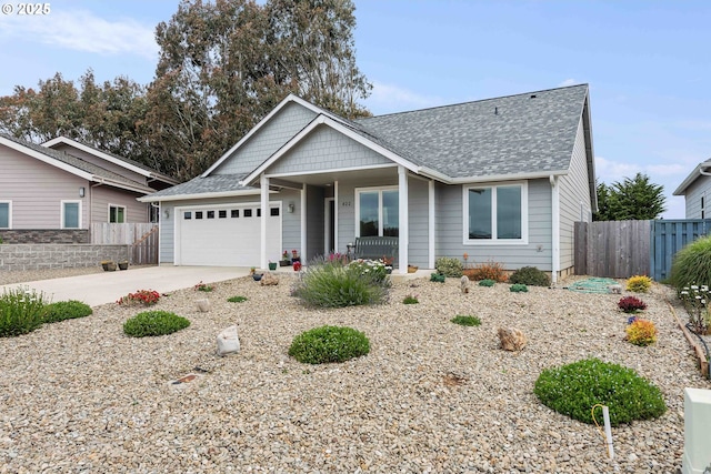 822 Spyglass Dr, Bandon, OR 97411 - view of front of property with roof with shingles, a porch, an attached garage, and driveway