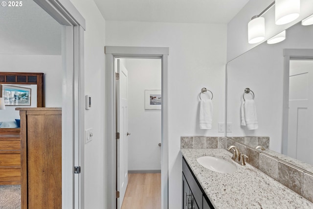 822 Spyglass Dr, Bandon, OR 97411 - bathroom featuring vanity and wood finished floors