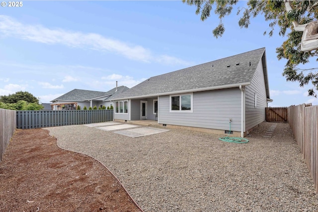 822 Spyglass Dr, Bandon, OR 97411 - back of house with a patio, a shingled roof, crawl space, and a fenced backyard