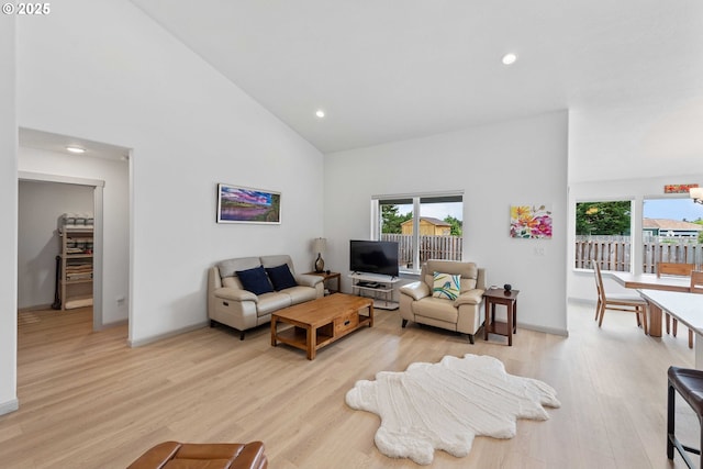 822 Spyglass Dr, Bandon, OR 97411 - living area featuring plenty of natural light, high vaulted ceiling, light wood-type flooring, and recessed lighting