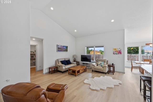 822 Spyglass Dr, Bandon, OR 97411 - living area featuring high vaulted ceiling, healthy amount of natural light, light wood finished floors, and recessed lighting
