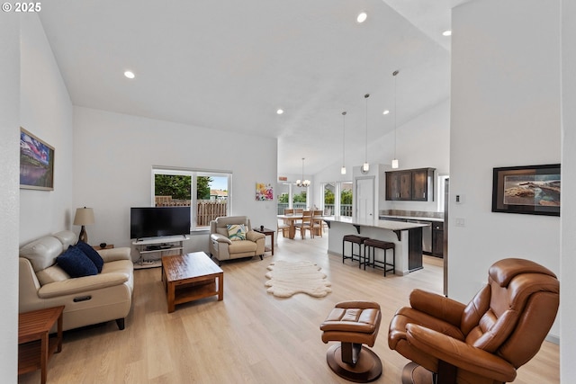 822 Spyglass Dr, Bandon, OR 97411 - living room with a chandelier, light wood-style floors, recessed lighting, and high vaulted ceiling
