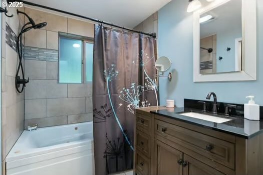 bathroom with shower / bath combination with curtain and vanity