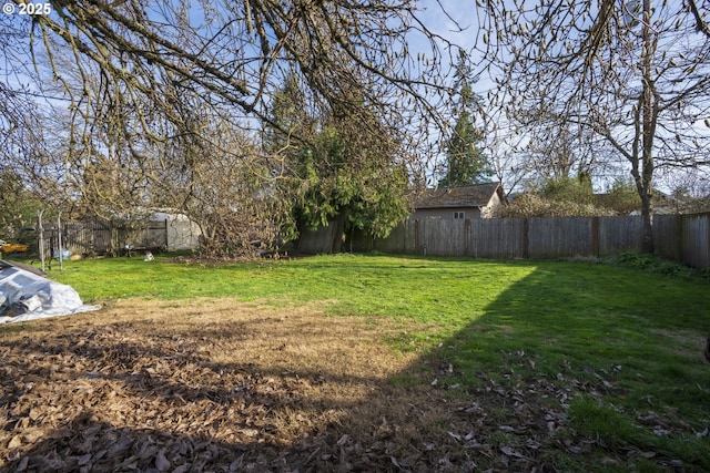 view of yard featuring a fenced backyard