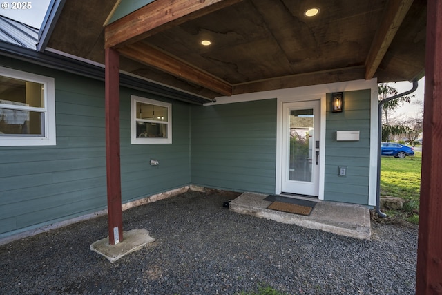 entrance to property featuring metal roof and a standing seam roof