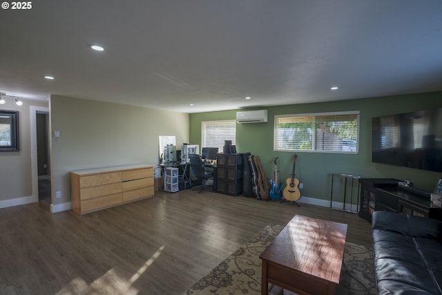 living room with recessed lighting, a wall mounted AC, and wood finished floors