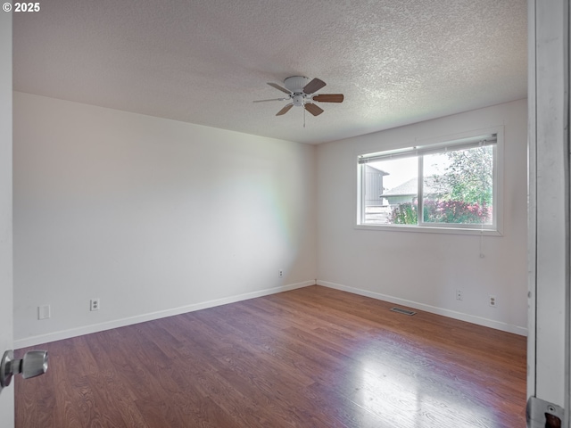 841 NE Kathryn St, Hillsboro, OR 97124 - empty room with a ceiling fan, wood finished floors, a textured ceiling, and baseboards
