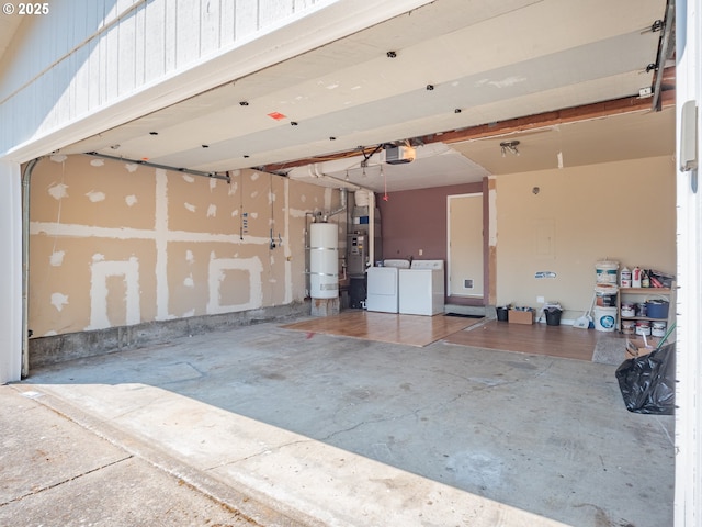841 NE Kathryn St, Hillsboro, OR 97124 - garage with strapped water heater, washer and dryer, a garage door opener, and heating unit