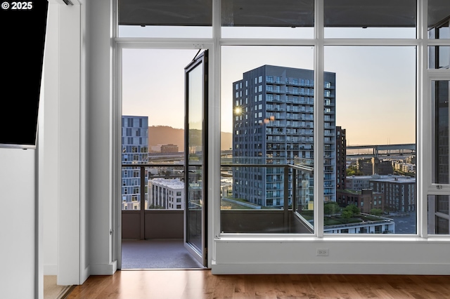 949 NW Overton St Unit 1304, Portland, OR 97209 - doorway to outside with a view of city and wood finished floors