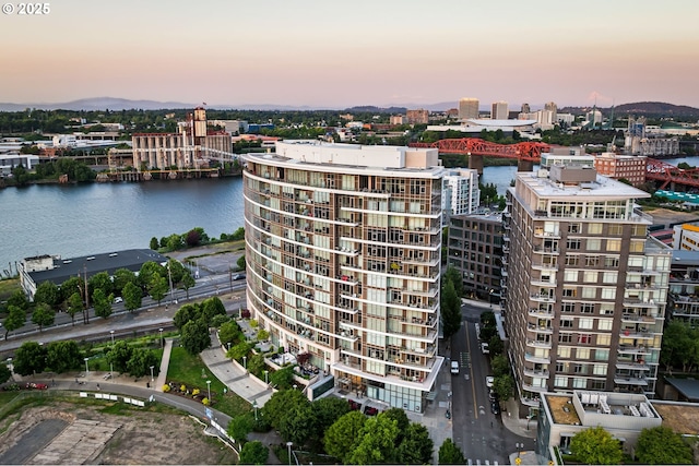 949 NW Overton St Unit 1304, Portland, OR 97209 - aerial view at dusk of a notable bridge, a water view, and a city view